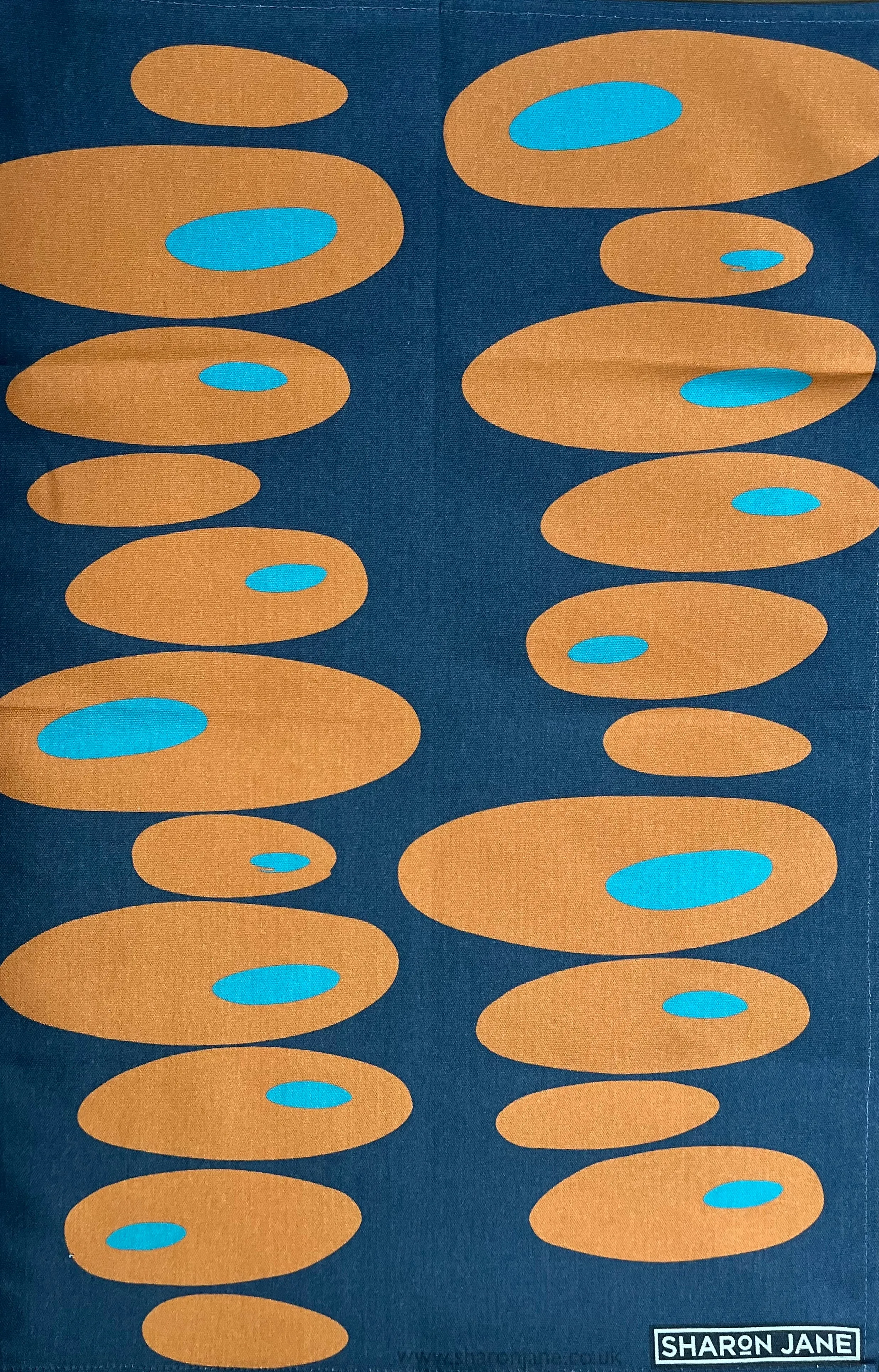 Pebbles Tea Towel - Navy   Orange