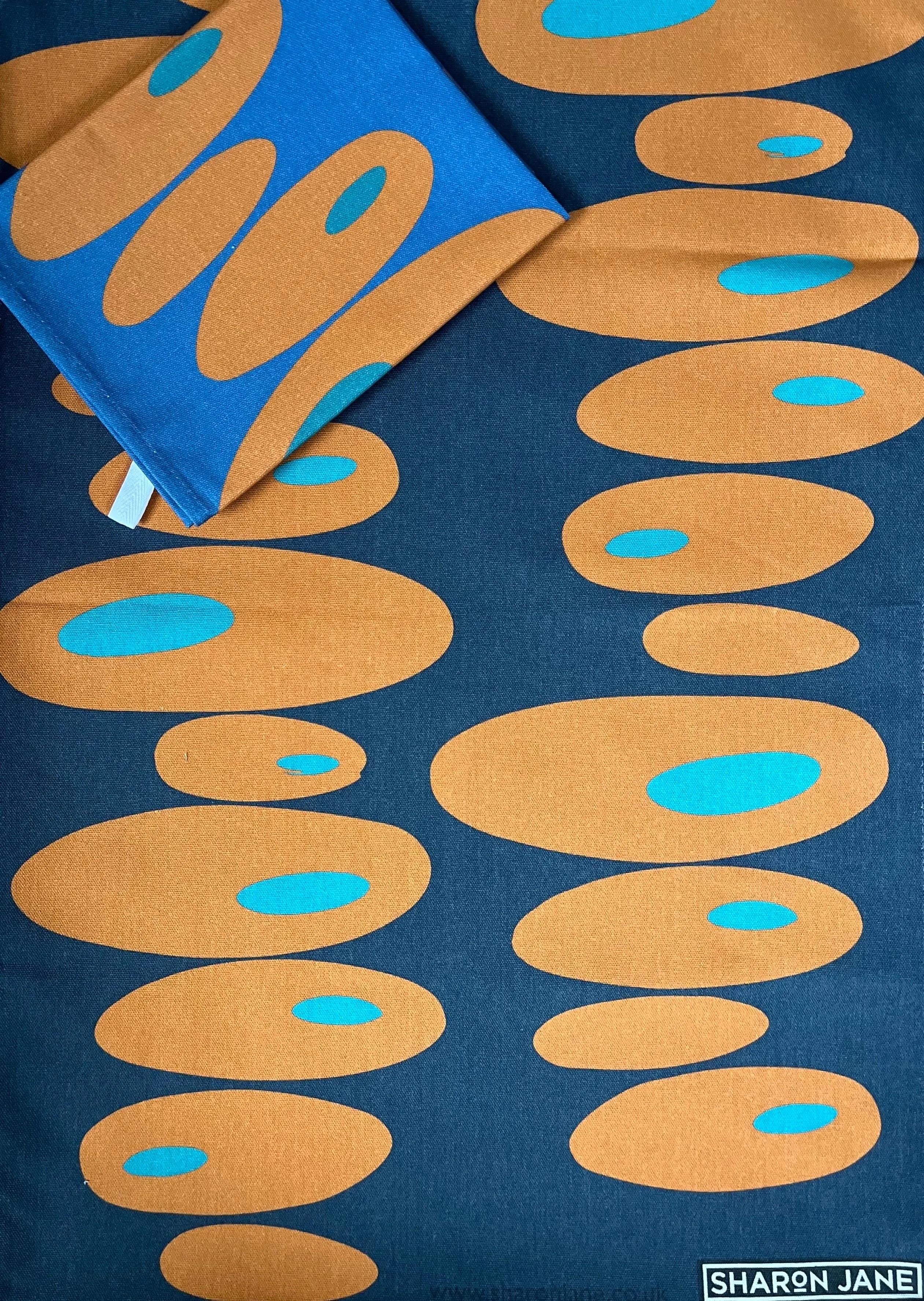 Pebbles Tea Towel - Navy   Orange